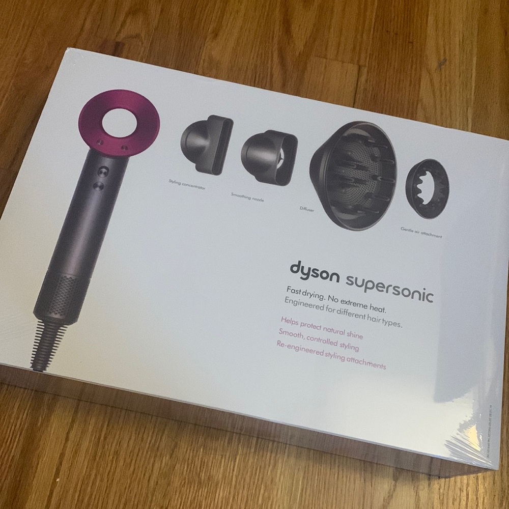 NEVER BEEN USED BEFORE. Perfect condition, still in plastic wrap. Fuschia Dyson